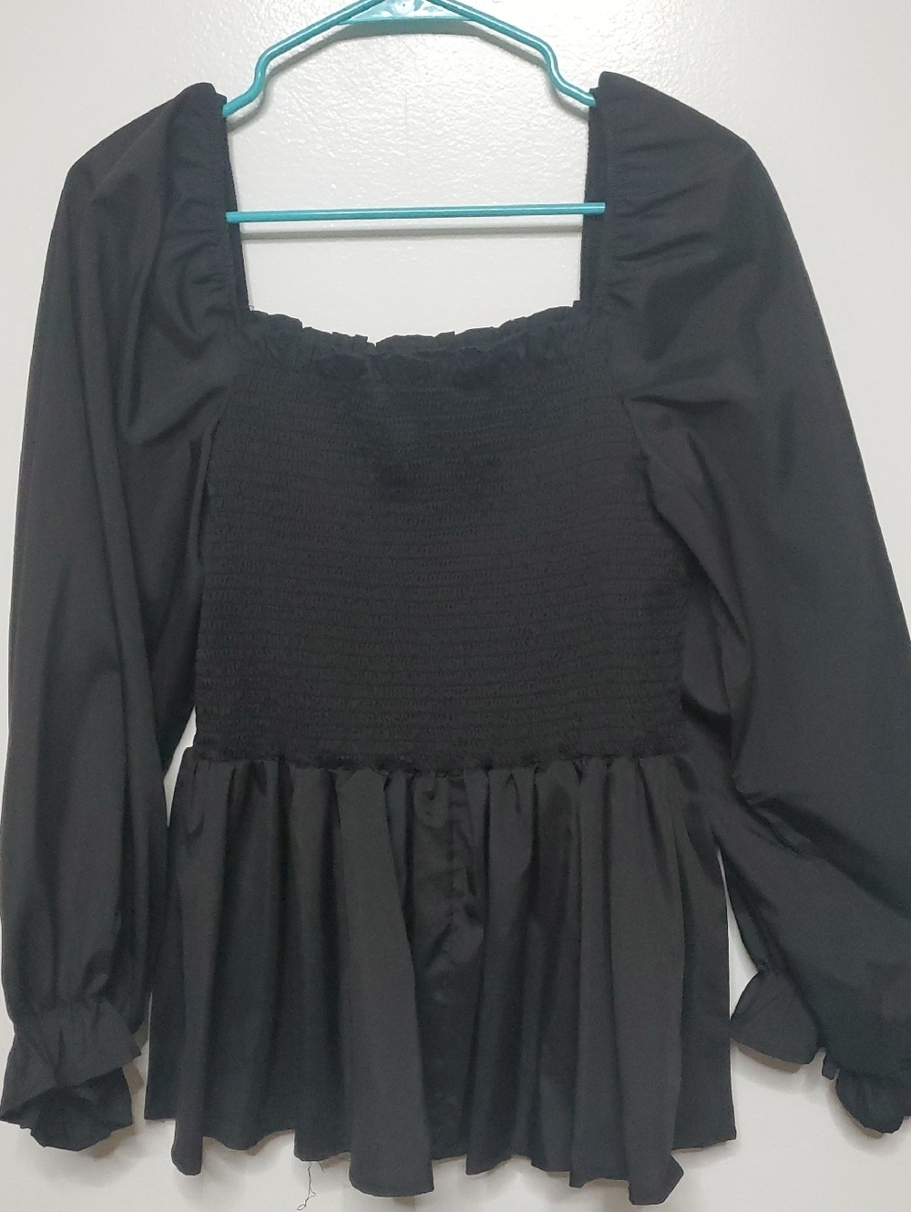 Black Smocked Peplum Long Sleeve Top
